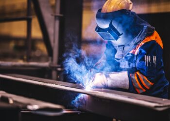 worker welding in a factory