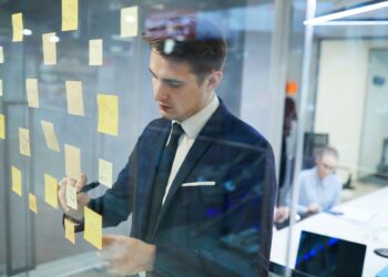 businessman writing his plans at office