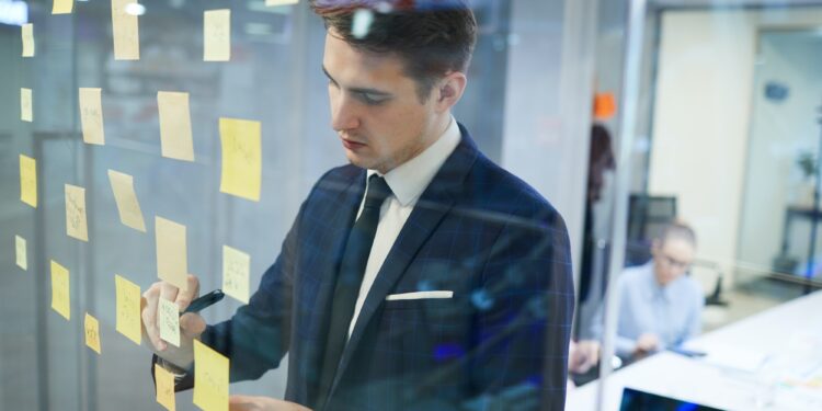 businessman writing his plans at office