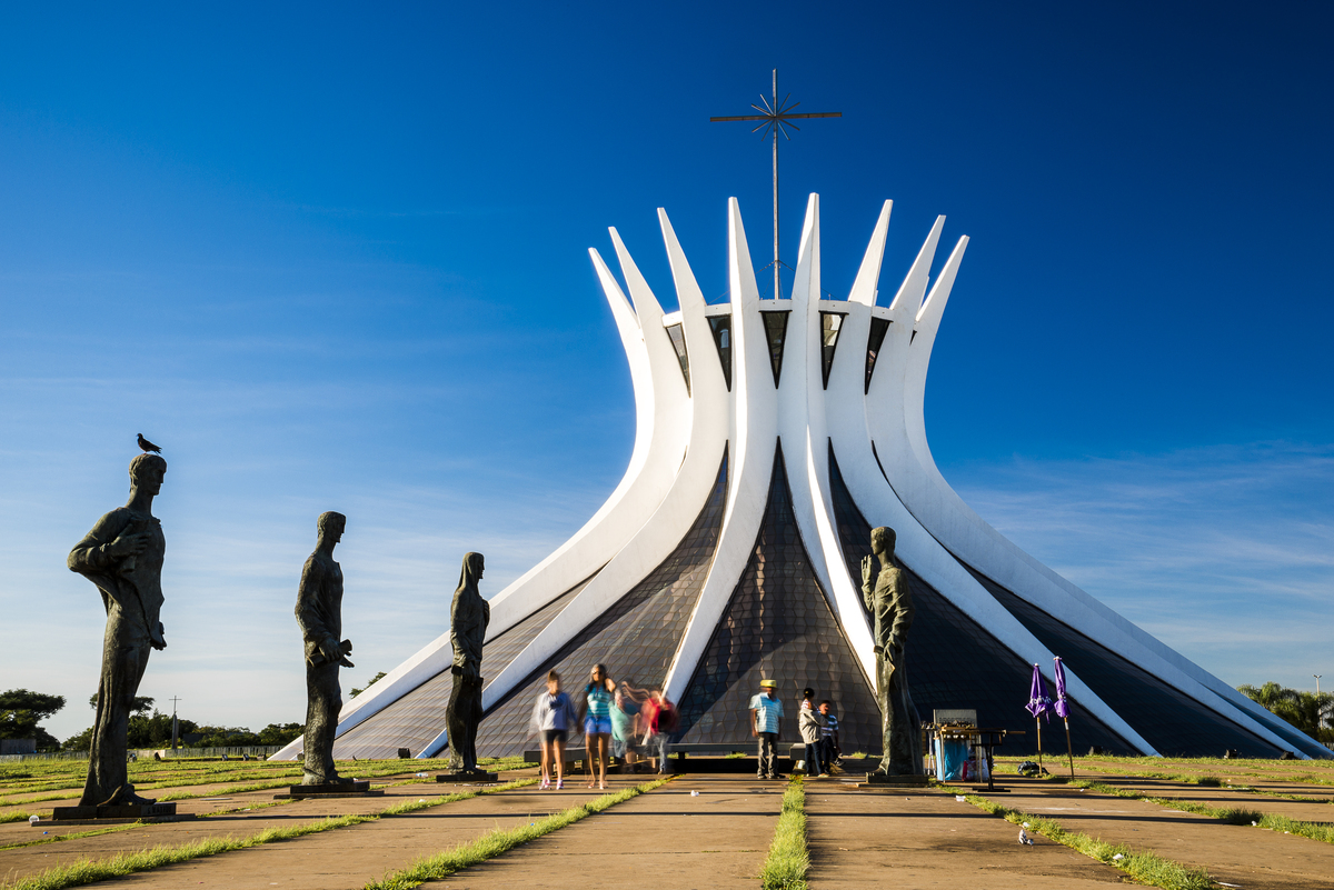 metropolitan cathedral brasilia dusk with its statues tourists foreground 1